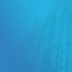 blue SKINS header with heritage high rise blurred image