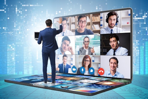 Conceptual image of virtual event, computer monitor with a grid of people.